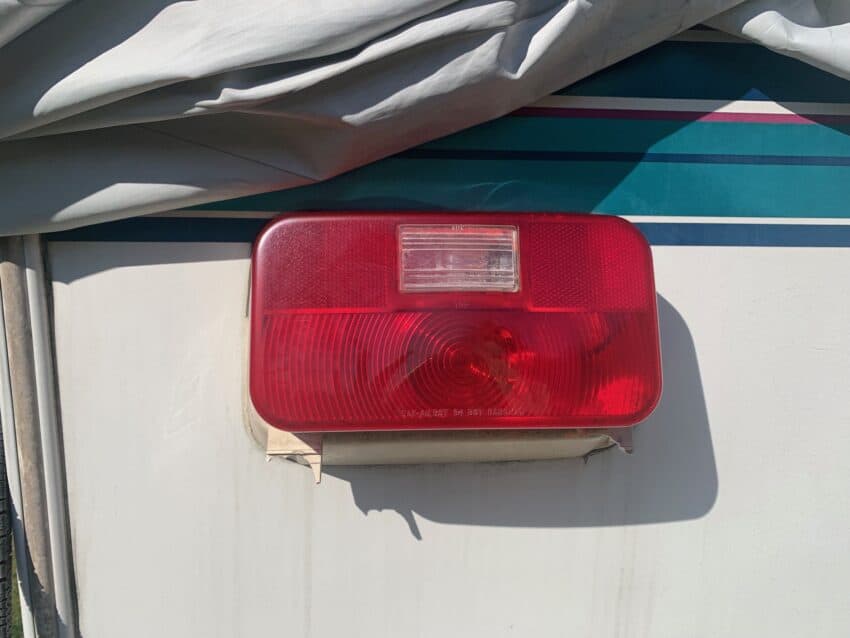tail light with broken license plate mounting bracket